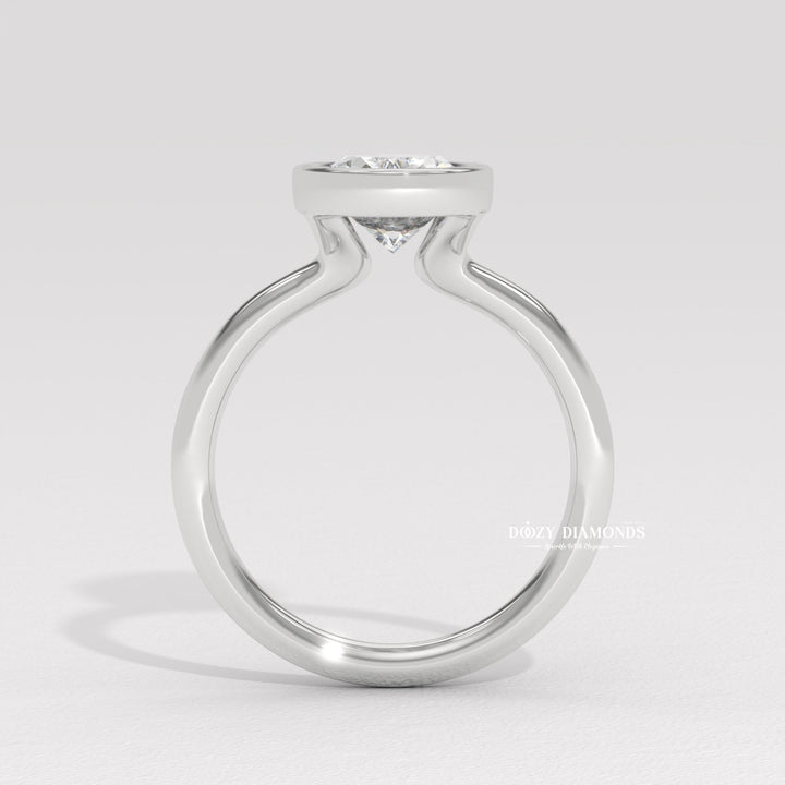 Fine craftsmanship detail on oval bezel engagement ring