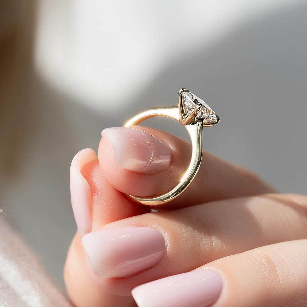 IGI certified cushion cut diamond in solitaire engagement ring setting