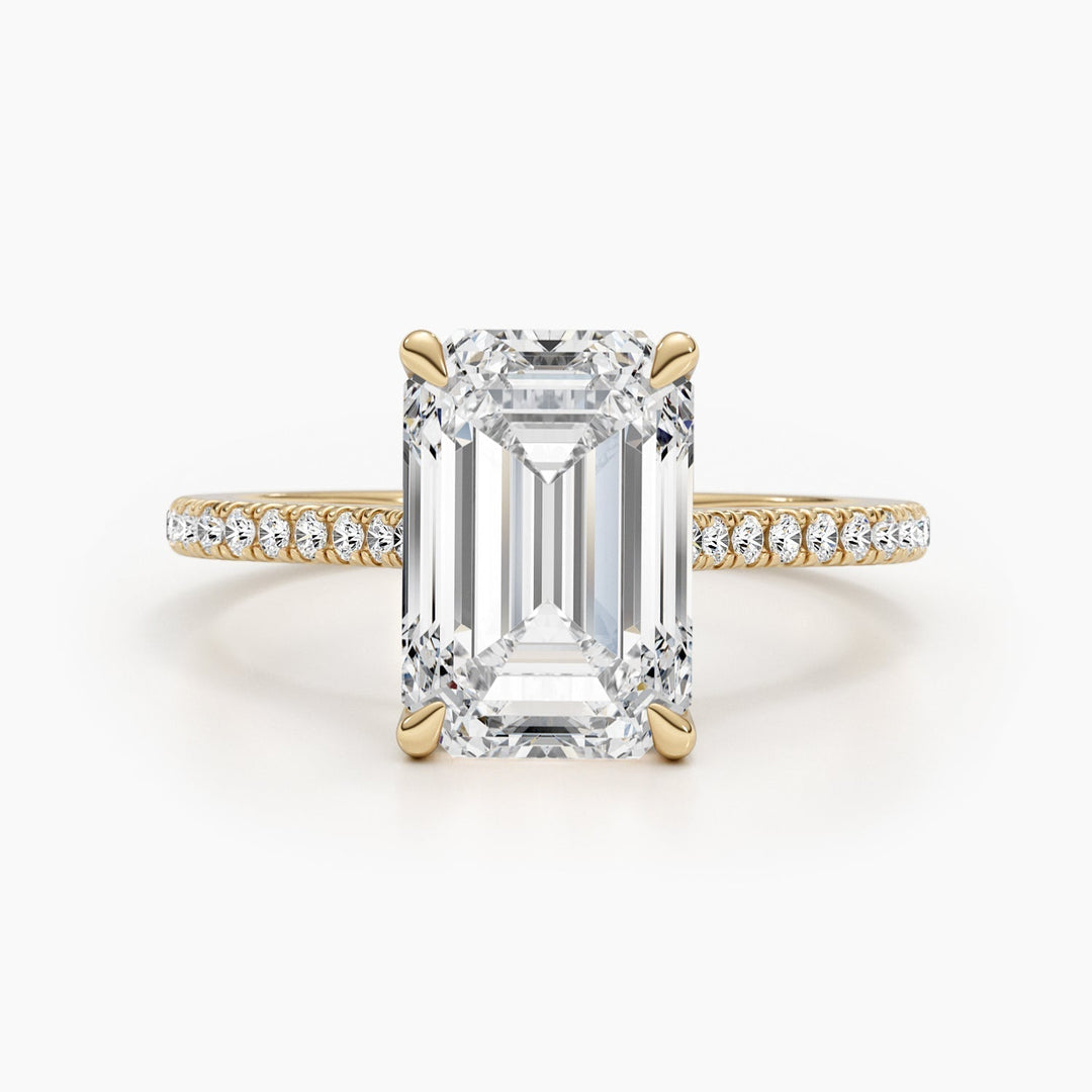 Emerald pave engagement ring finished in polished solid gold