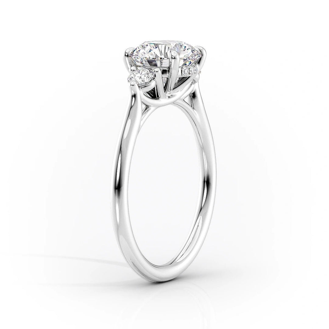 Certified oval cut diamond featured in three stone engagement ring