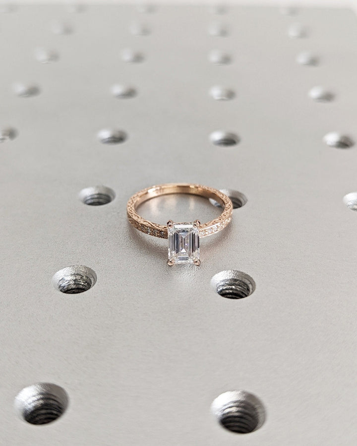 Unboxing view of emerald cut vintage diamond engagement ring