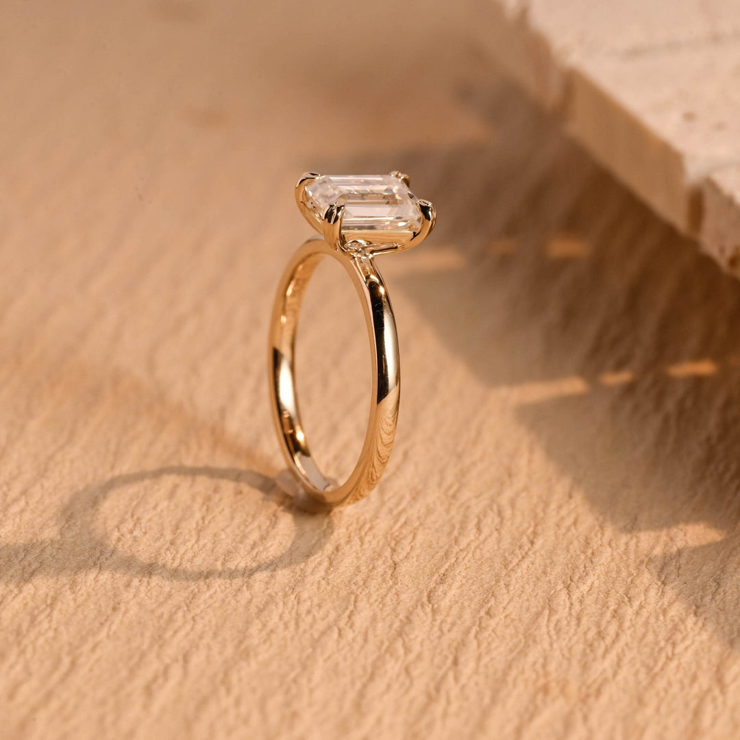 Macro shot of emerald cut diamond facets in solitaire ring setting