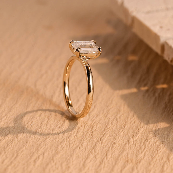 Macro shot of emerald cut diamond facets in solitaire ring setting
