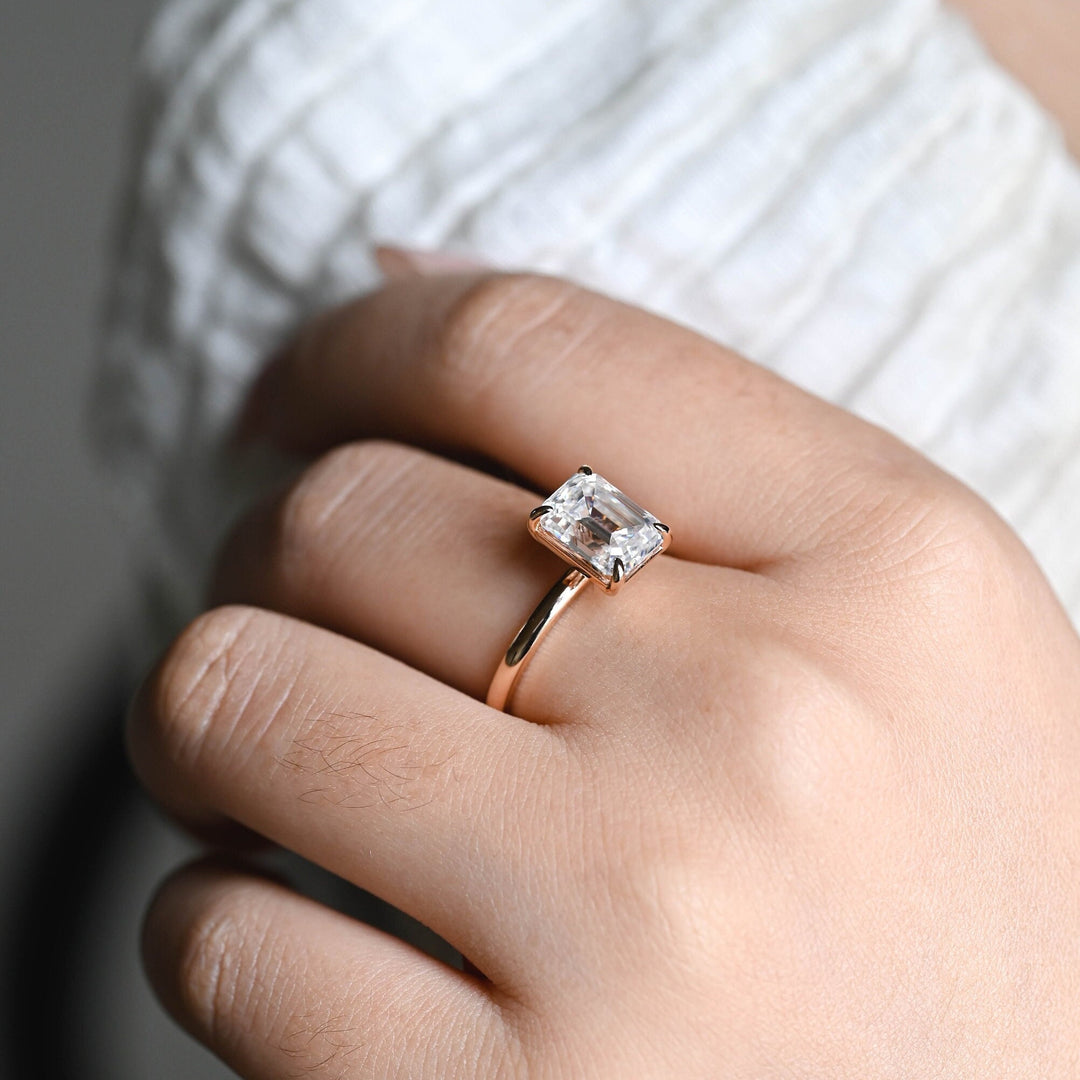 Emerald cut solitaire engagement ring with IGI certified center diamond