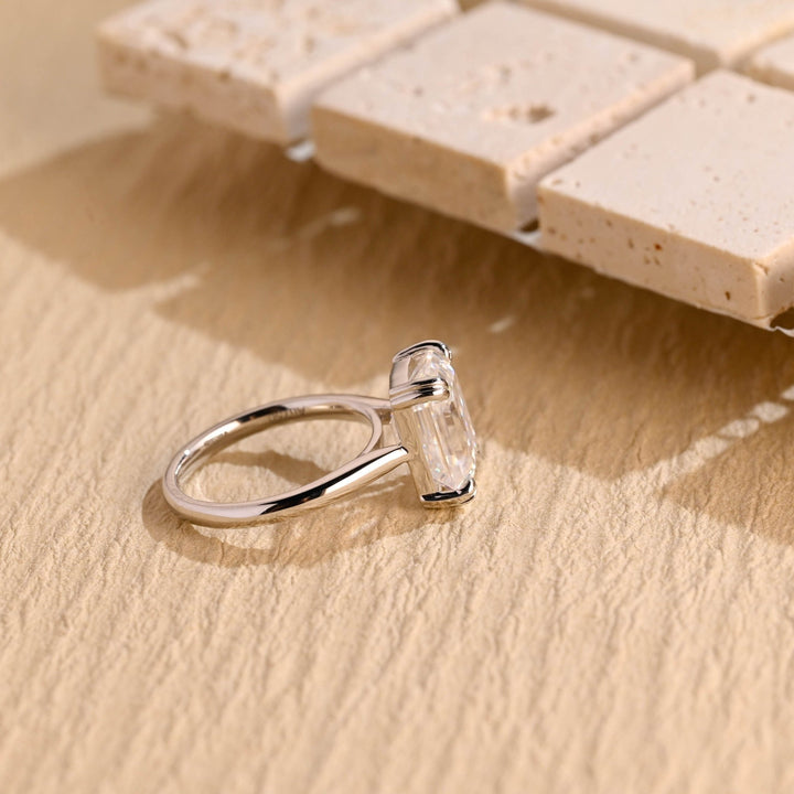 Classic emerald solitaire engagement ring crafted for everyday wear