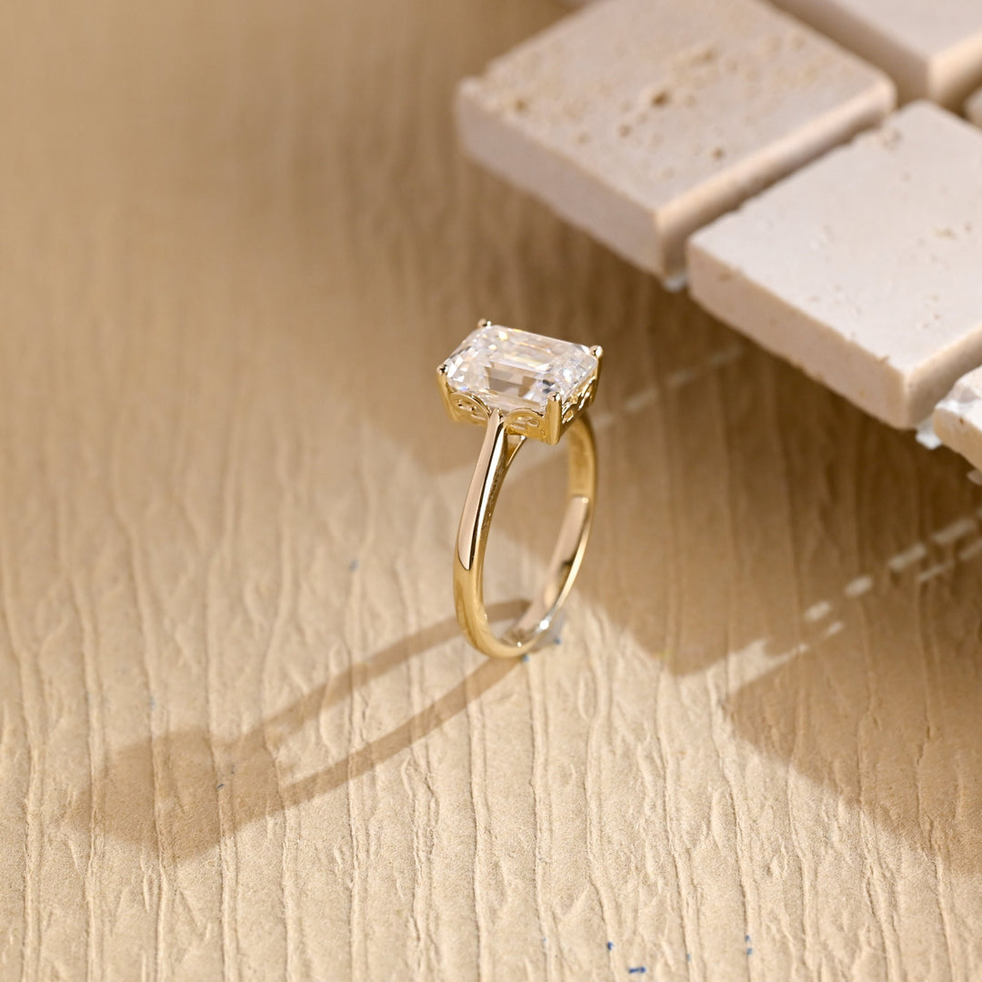 Profile view of emerald cut solitaire engagement ring band