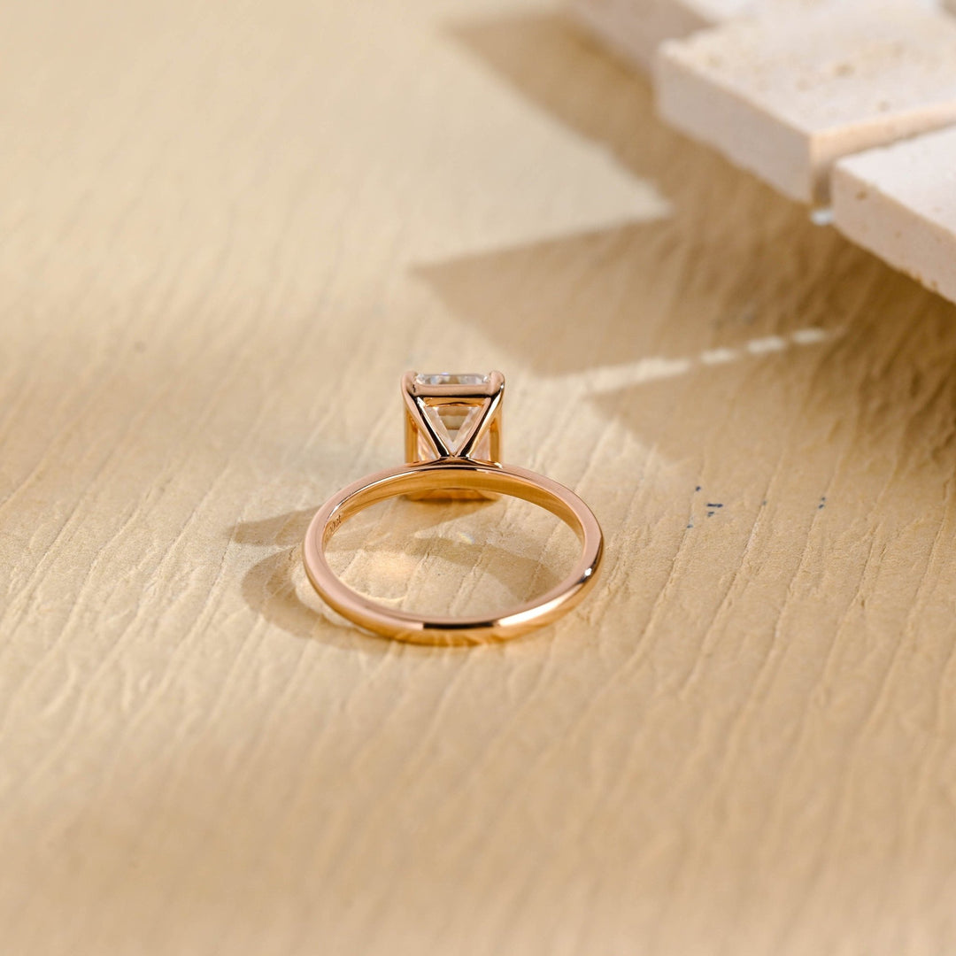 Emerald solitaire lab grown diamond ring fitted on finger
