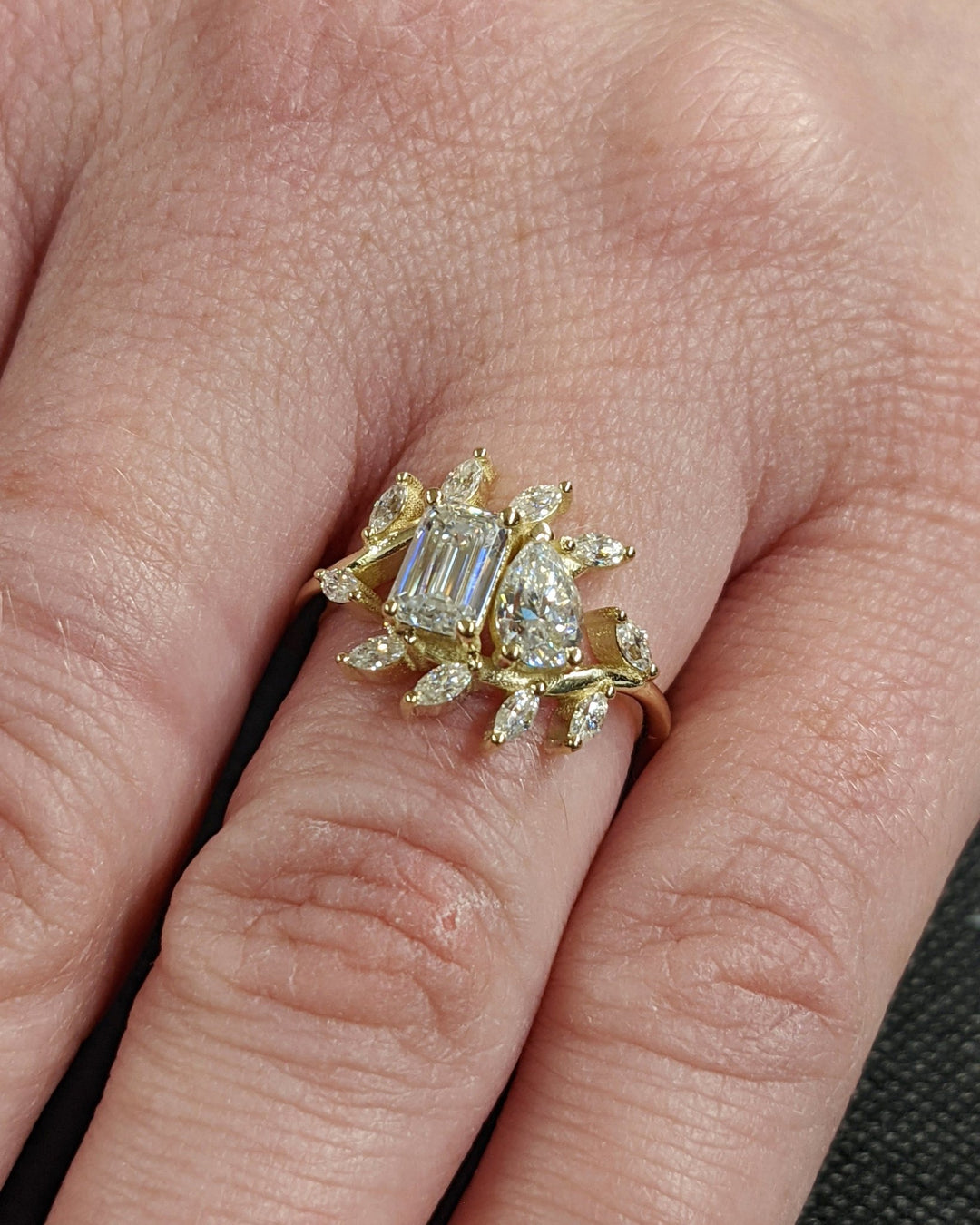 IGI certified pear cut diamond in cluster engagement ring setting