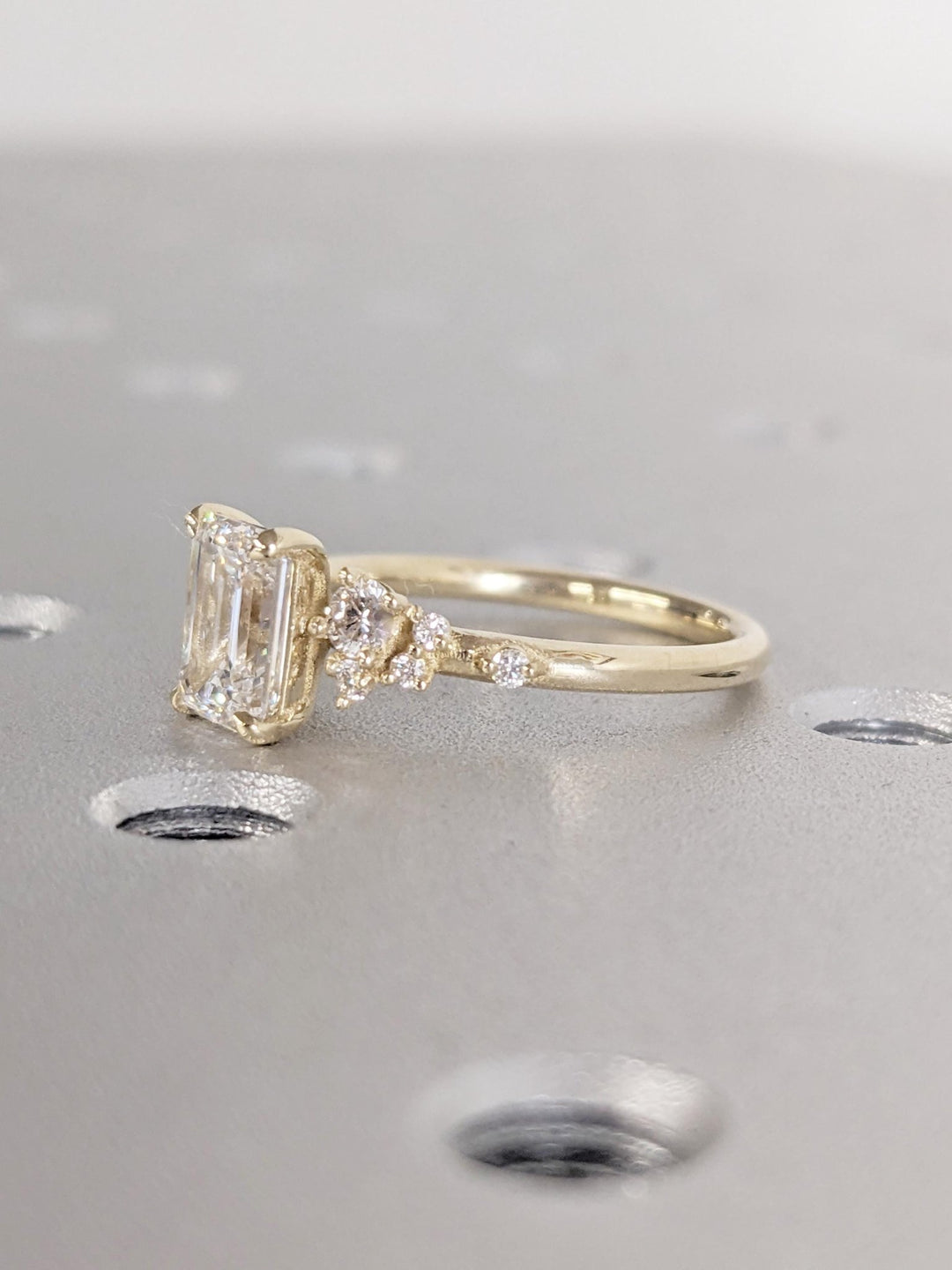 Top-down view of emerald cut cluster engagement ring