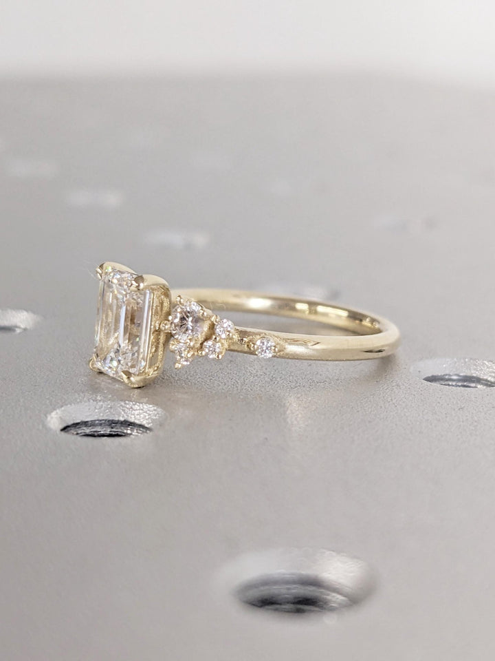 Top-down view of emerald cut cluster engagement ring