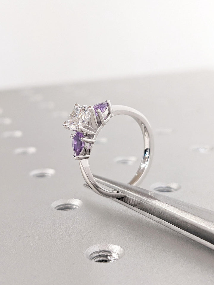 Round solitaire engagement ring photographed in natural light