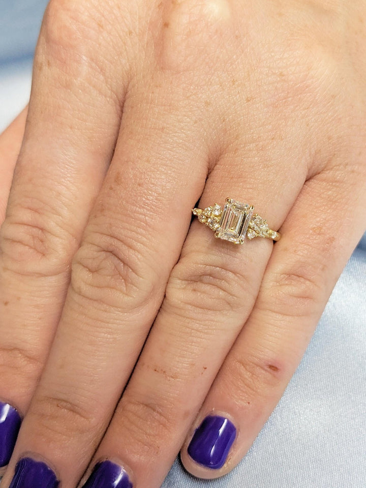 Fine craftsmanship detail on emerald cluster engagement ring