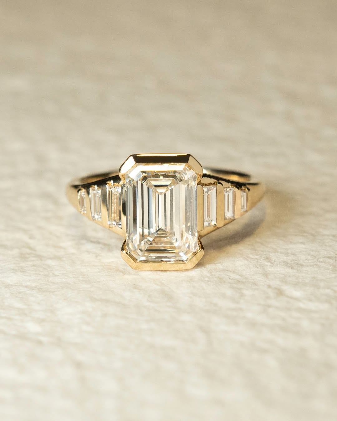 Emerald solitaire diamond engagement ring available in multiple metals