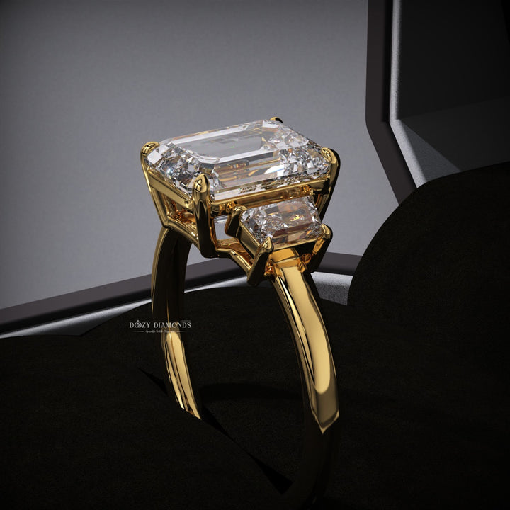 IGI certified emerald cut diamond in three stone engagement ring setting