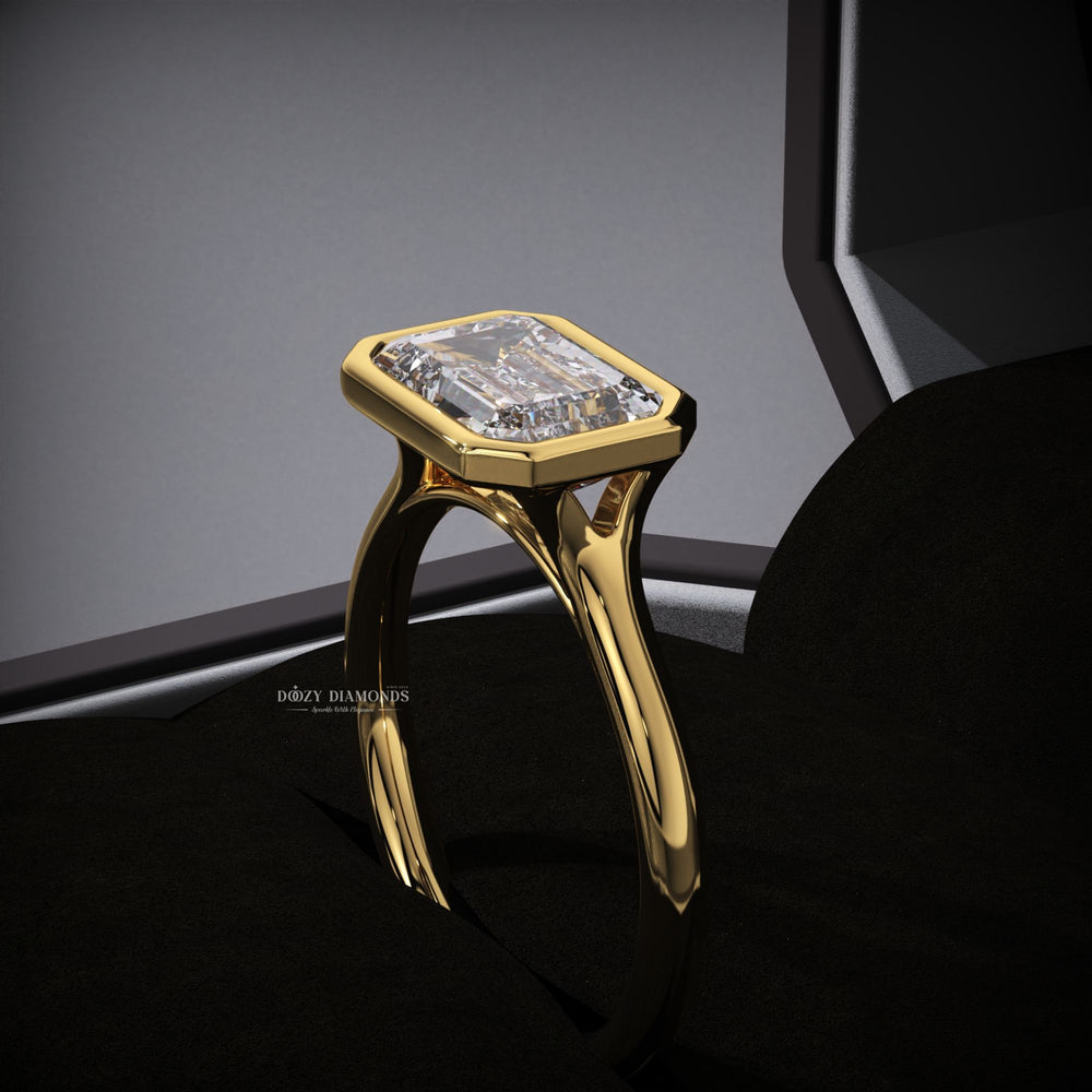 Emerald east west engagement ring with brilliant diamond sparkle