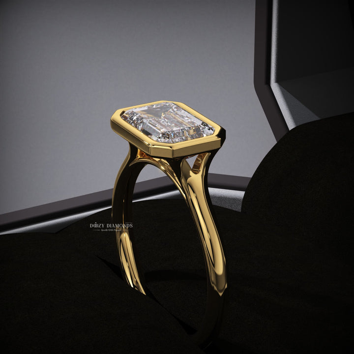 Emerald east west engagement ring with brilliant diamond sparkle