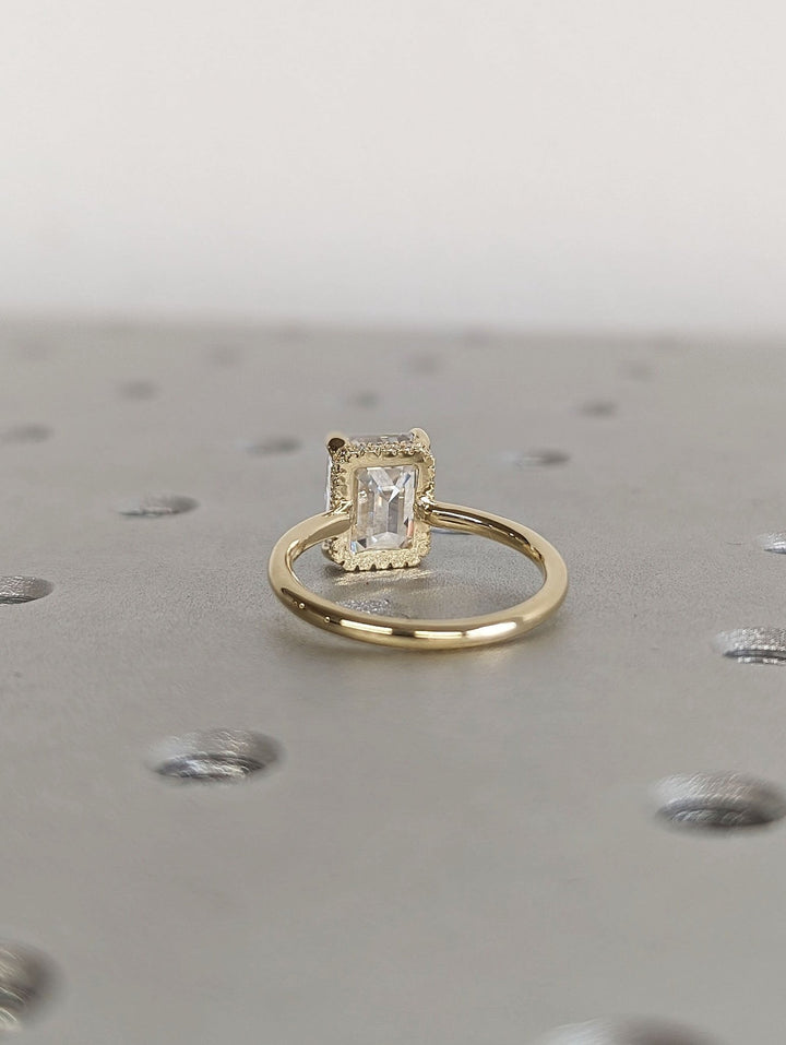 Emerald cut engagement ring side view showing band detail