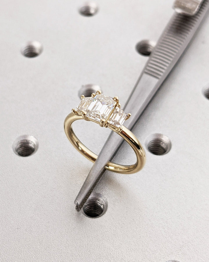Close-up of emerald cut center diamond in solitaire engagement ring