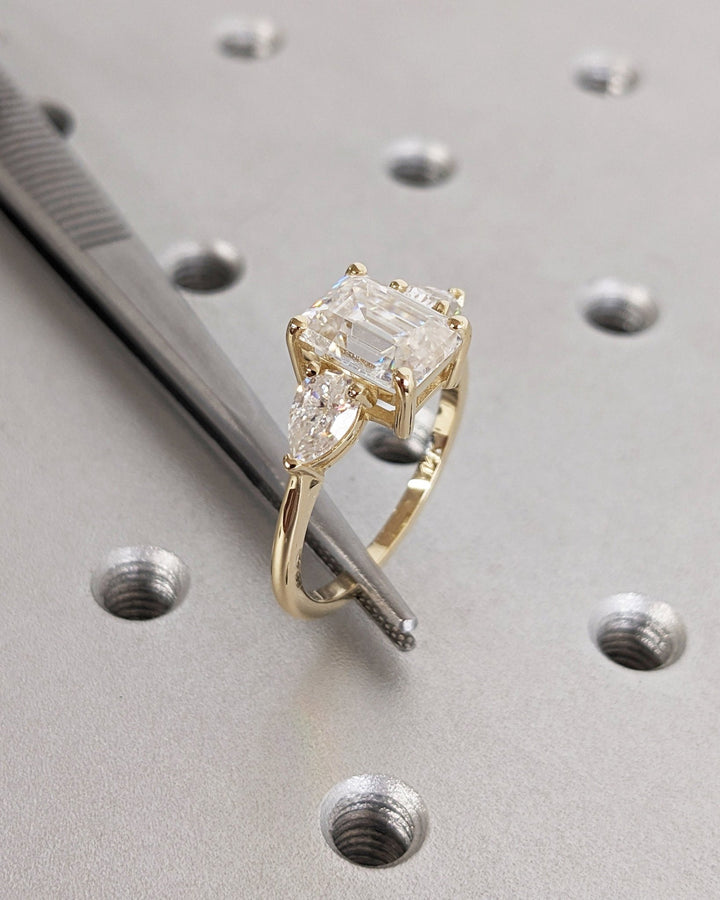 Macro shot of emerald cut diamond facets in solitaire ring setting