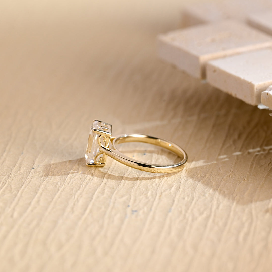 Emerald cut engagement ring side view showing band detail