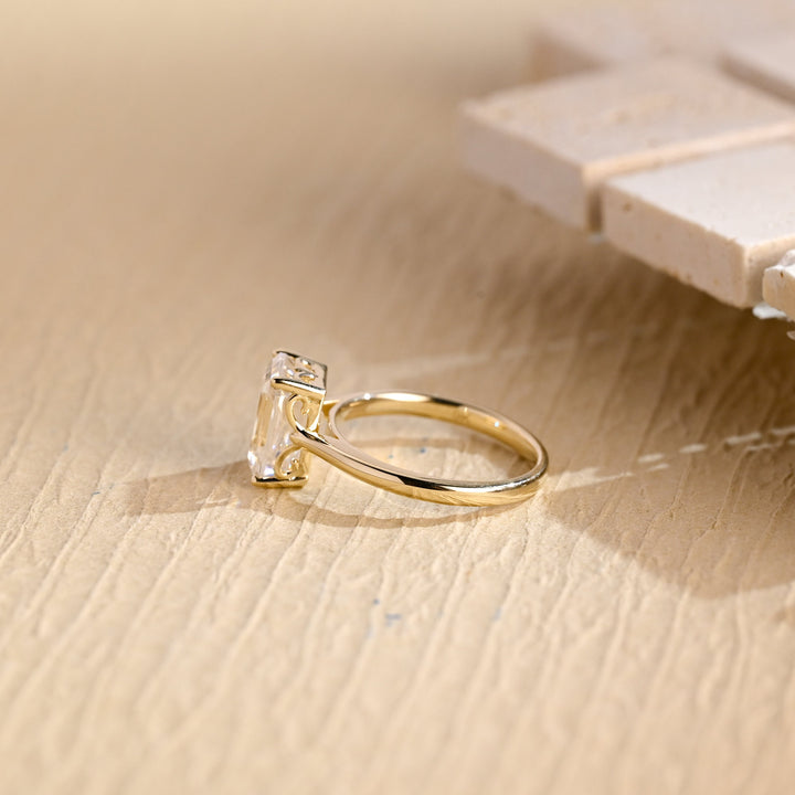 Emerald cut engagement ring side view showing band detail