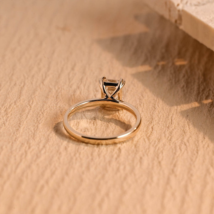 Emerald solitaire engagement ring close-up showing high clarity diamond clarity