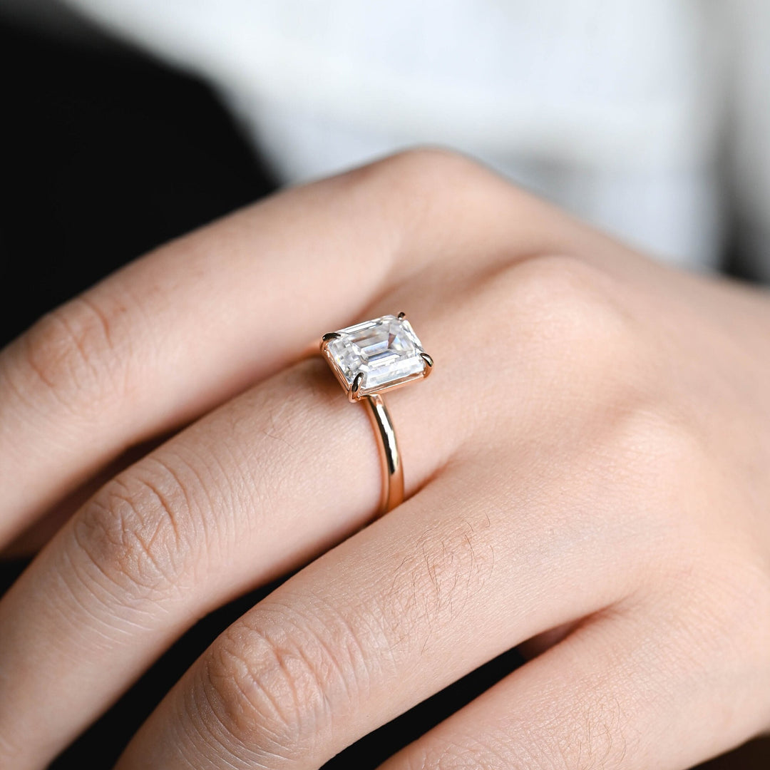 IGI certified emerald cut diamond in solitaire engagement ring setting
