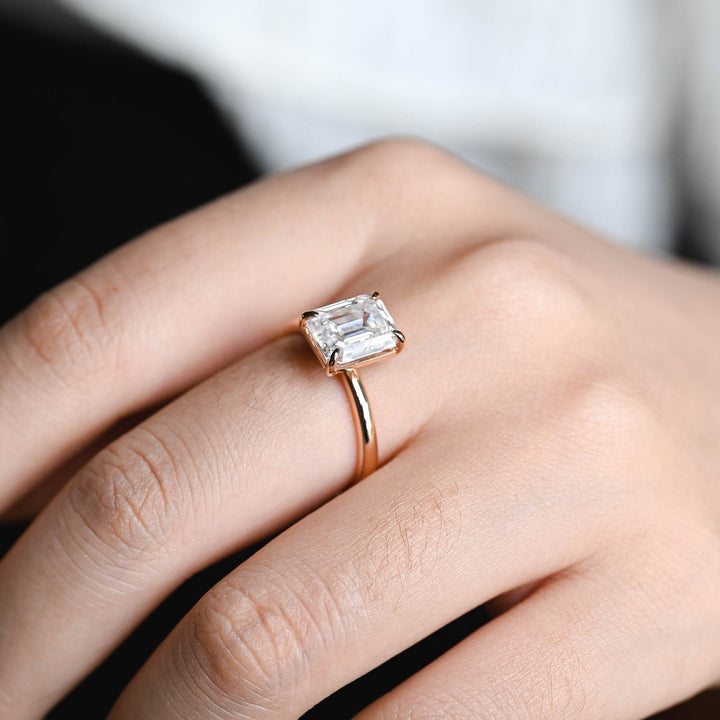 IGI certified emerald cut diamond in solitaire engagement ring setting
