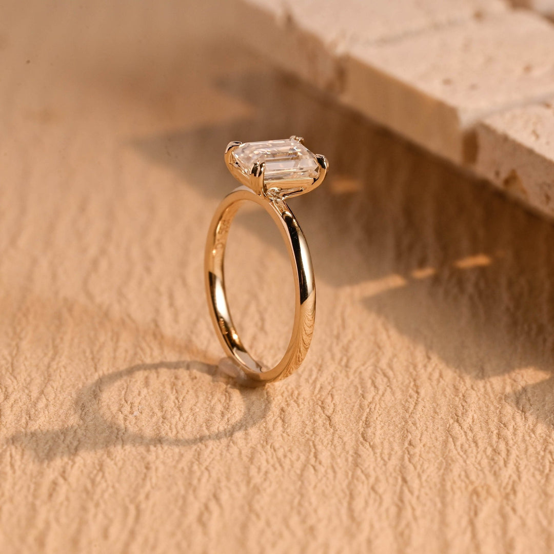Close-up of emerald cut center diamond in solitaire engagement ring