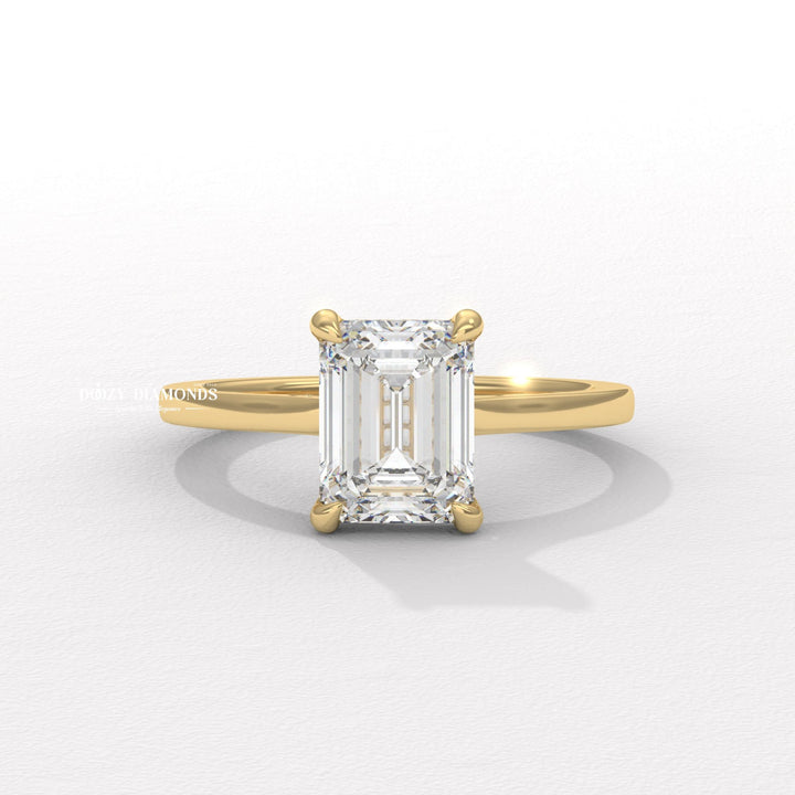 Emerald cut hidden halo engagement ring available to buy now