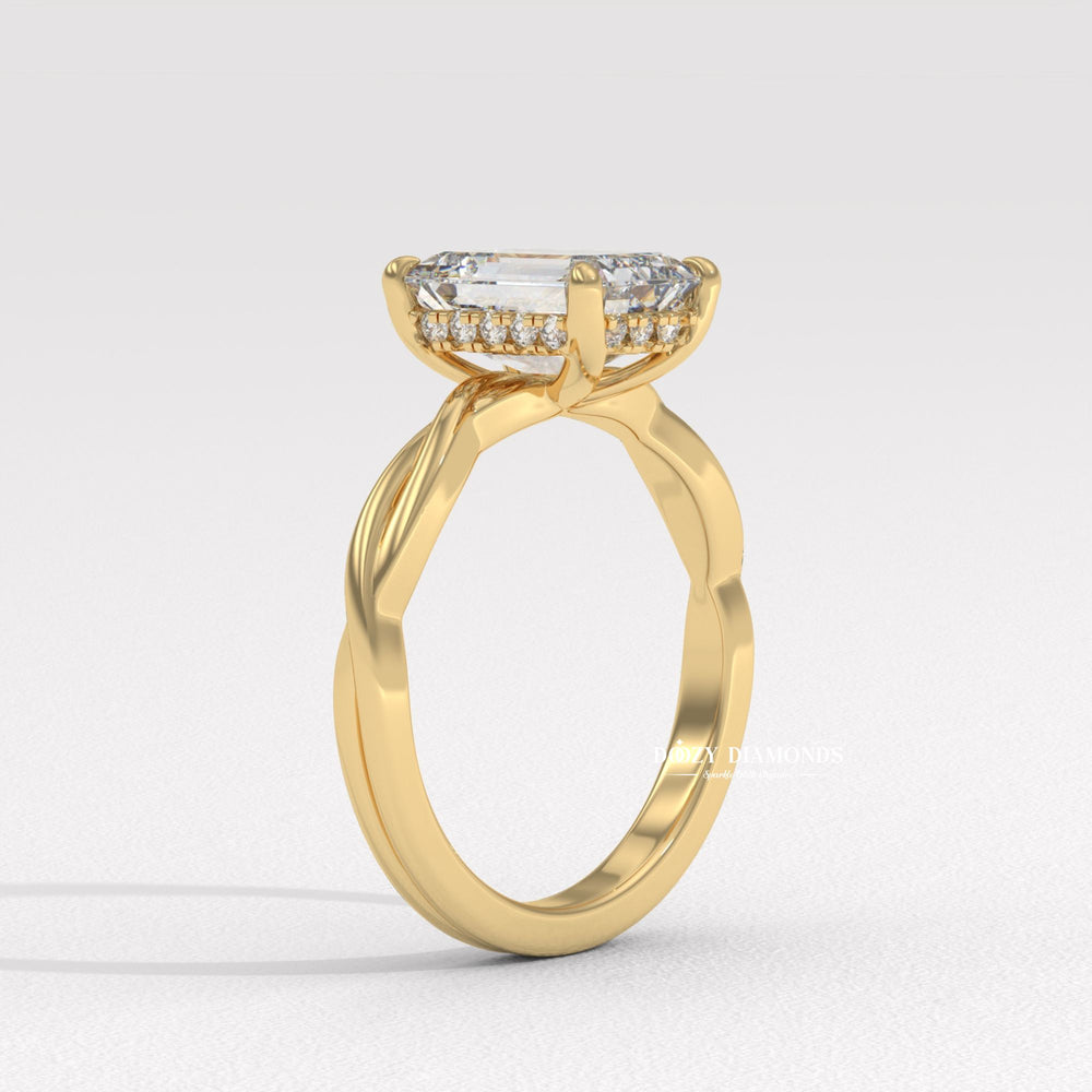 Emerald cut engagement ring shown with authenticity certificate
