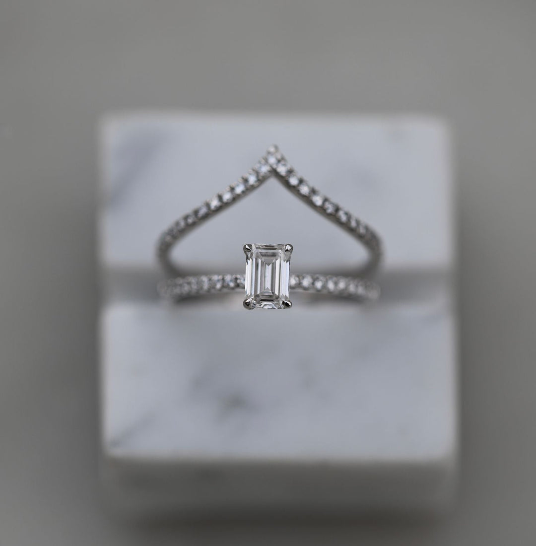 IGI certified emerald cut diamond in solitaire engagement ring setting