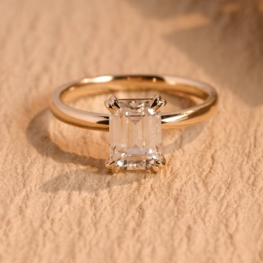 Emerald cut engagement ring side view showing band detail