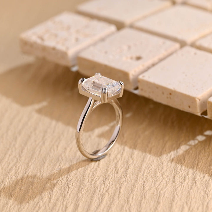 Emerald solitaire engagement ring finished in polished solid gold