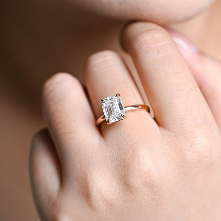 Emerald solitaire engagement ring with certified lab grown diamond