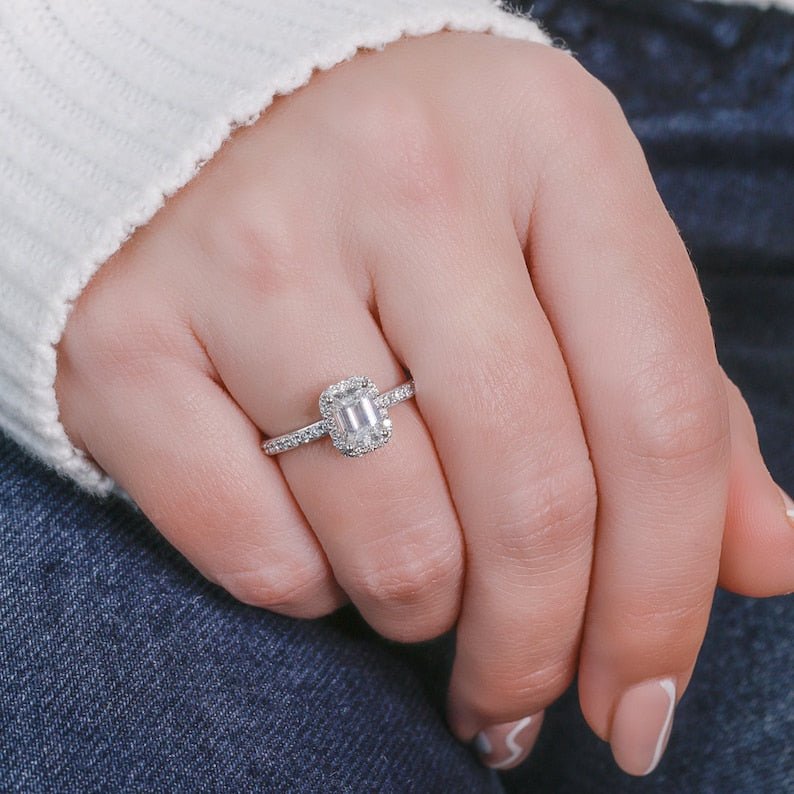 Emerald halo lab grown diamond ring fitted on finger