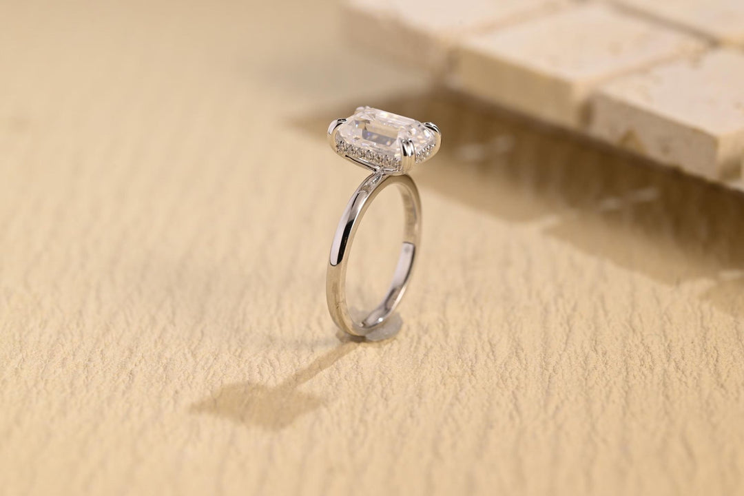 Emerald hidden halo diamond ring presented in signature gift packaging