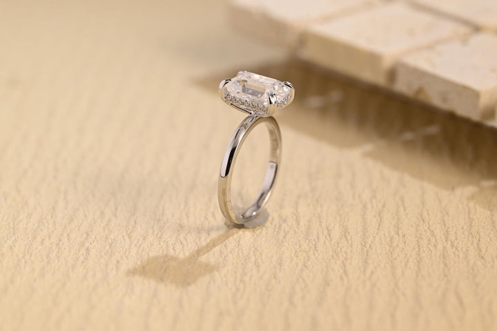 Emerald hidden halo diamond ring presented in signature gift packaging