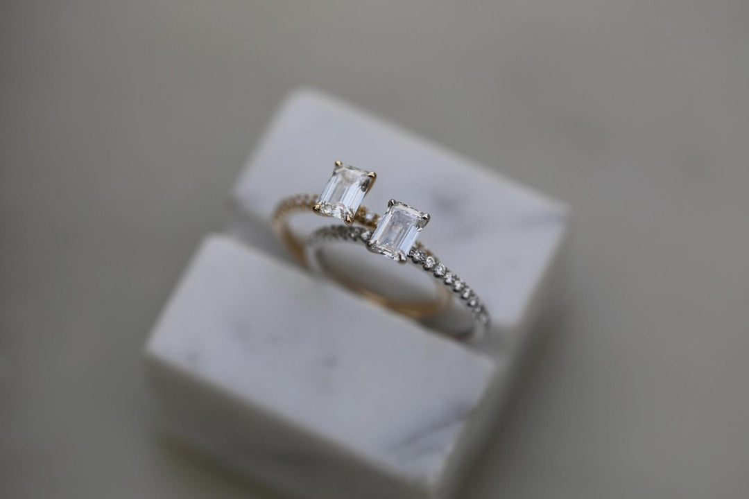 Emerald cut solitaire engagement ring with IGI certified center diamond