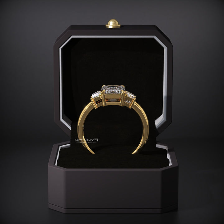 Emerald cut three stone engagement ring with IGI certified center diamond