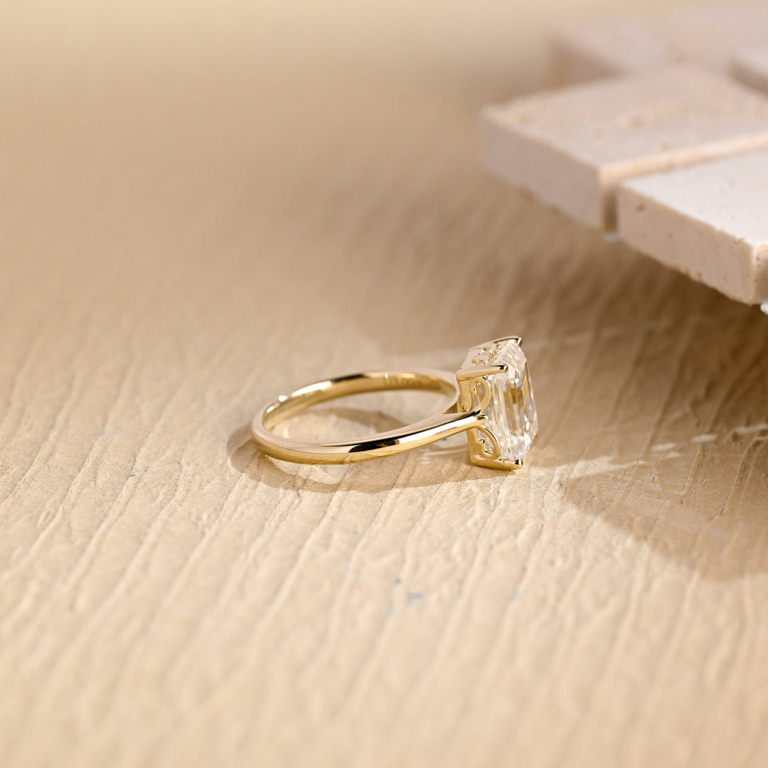 Detailed close-up of emerald solitaire diamond engagement ring