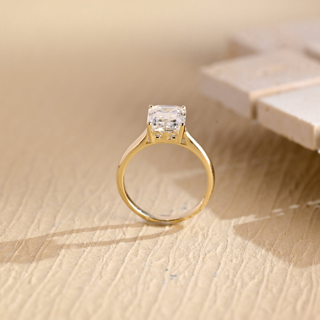 Emerald cut diamond ring worn on hand