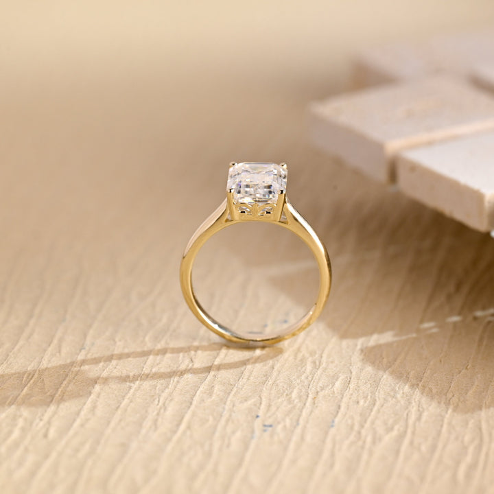 Emerald cut diamond ring worn on hand