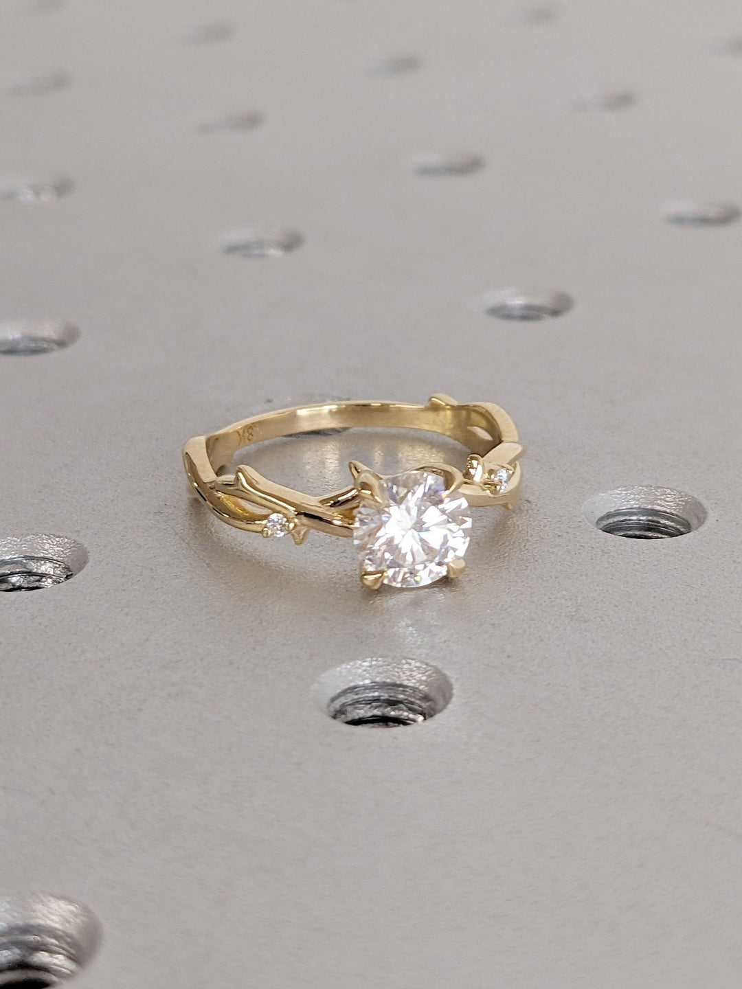 Round solitaire diamond ring presented in signature gift packaging