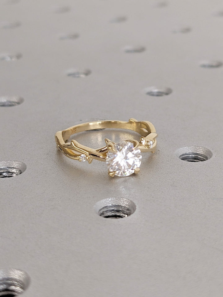 Round solitaire diamond ring presented in signature gift packaging