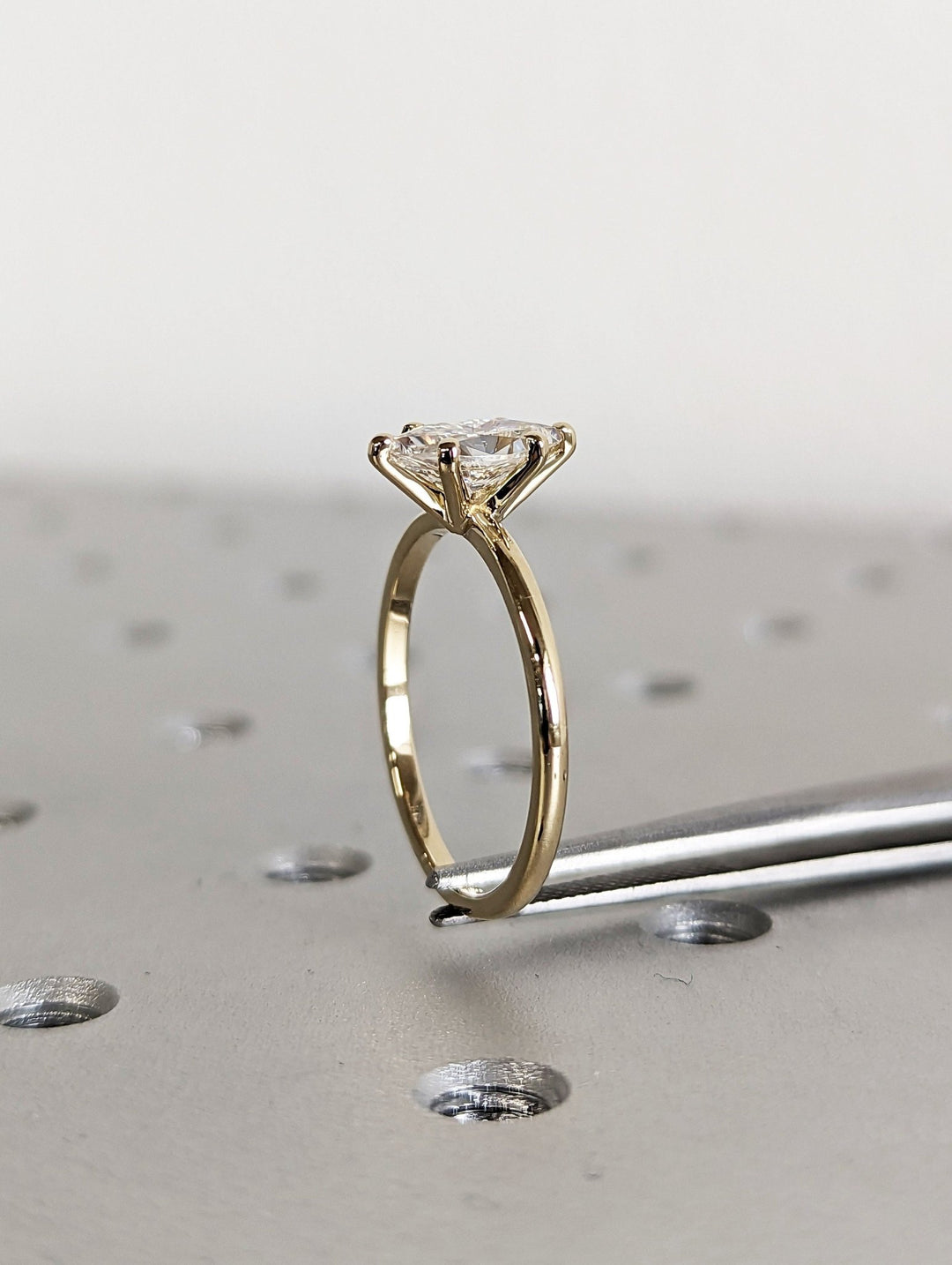 Marquise cut solitaire engagement ring with IGI certified center diamond