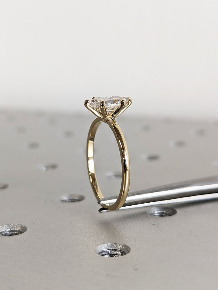 Marquise cut solitaire engagement ring with IGI certified center diamond