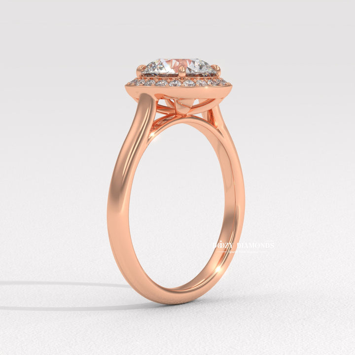 Round halo engagement ring finished in polished solid gold
