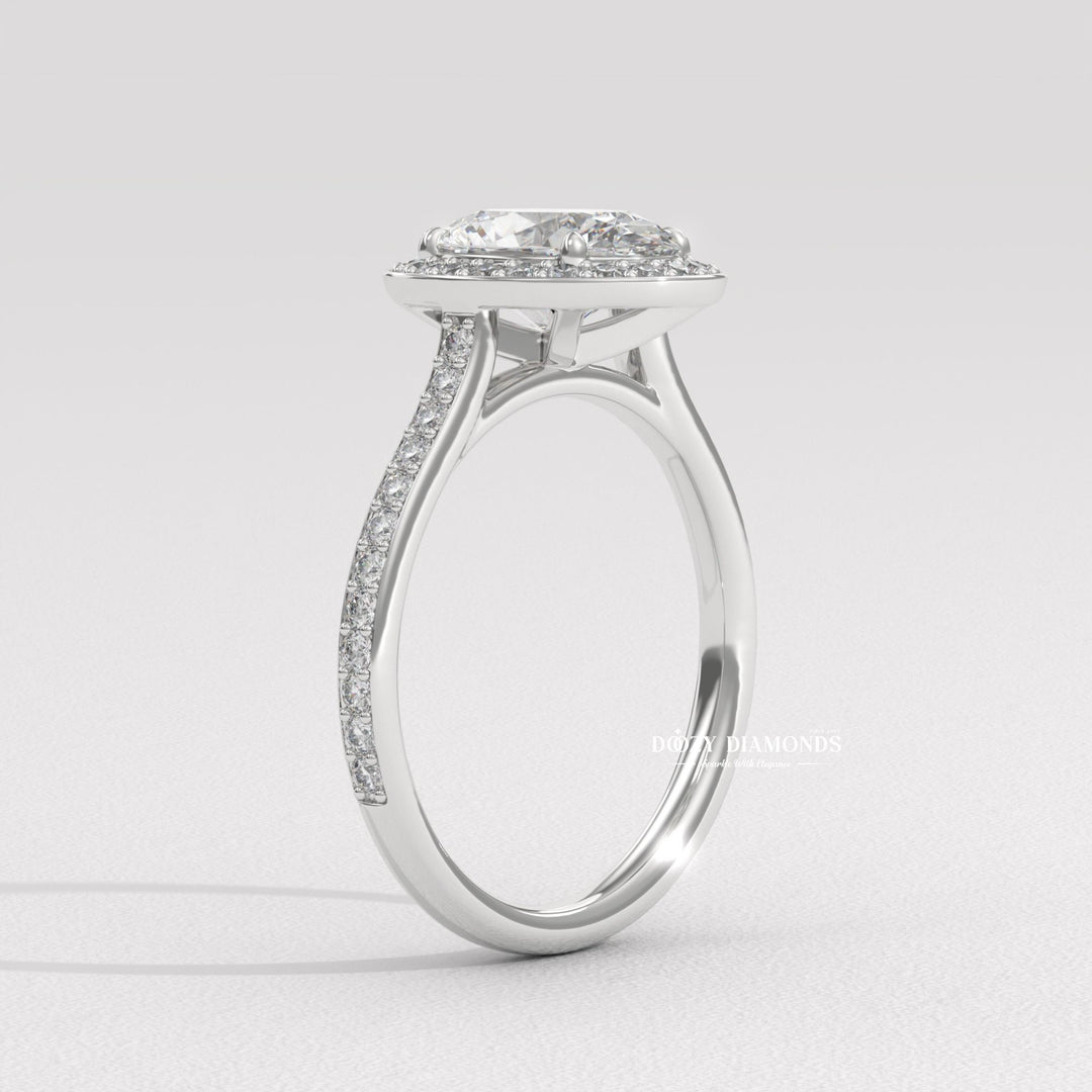 Oval halo diamond engagement ring available in multiple metals