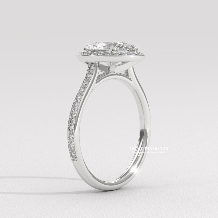 Oval halo diamond engagement ring available in multiple metals